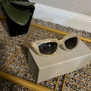 DEZI limestone sunglasses in “On Read” style. Elongated rectangle cat-eye frame.